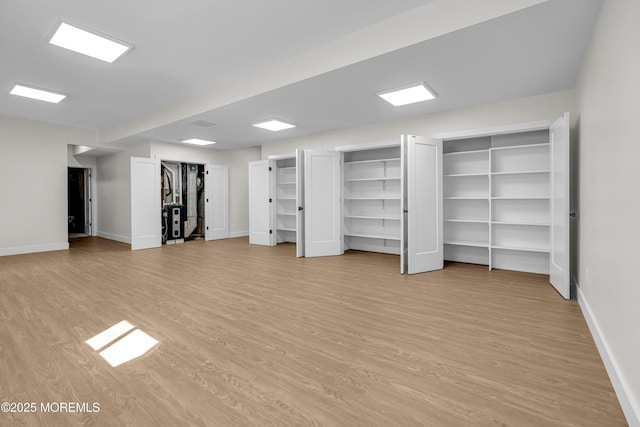 21 Pension Hill Rd, Manalapan, NJ 07726 - unfurnished living room featuring light wood-style flooring and baseboards