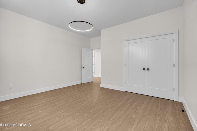21 Pension Hill Rd, Manalapan, NJ 07726 - unfurnished bedroom with wood finished floors and a closet