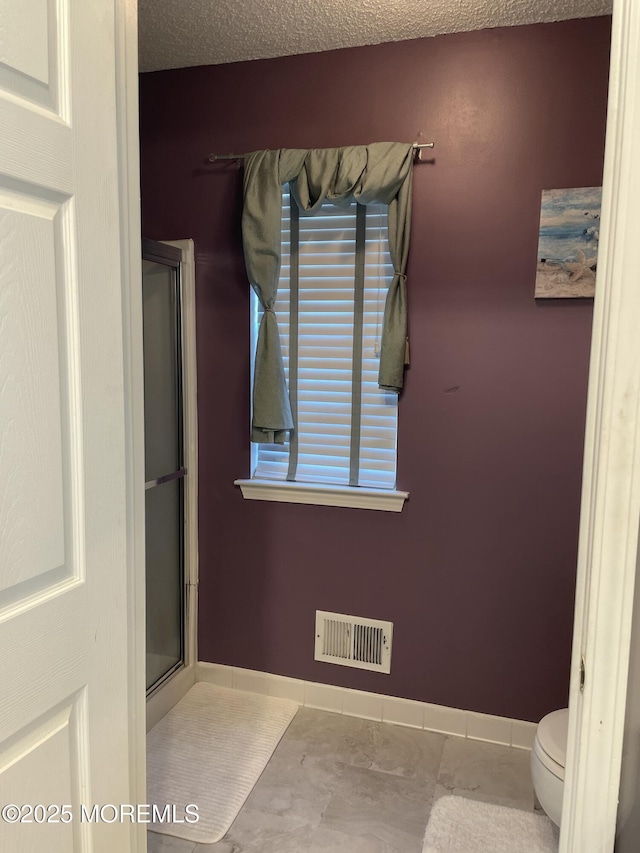 25 Watson Ct, Howell, NJ 07731 - full bath with an enclosed shower and a textured ceiling