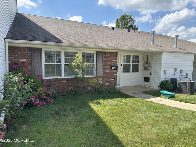 9 Maine Ct Unit 741, Matawan, NJ 07747 - back of property with brick siding, a shingled roof, and a lawn