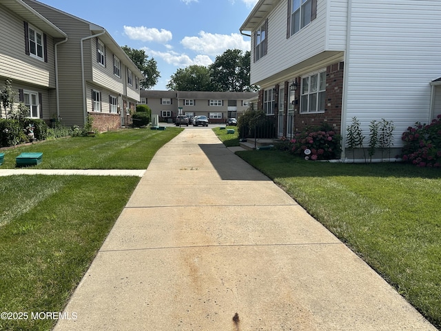 9 Maine Ct Unit 741, Matawan, NJ 07747 - view of community featuring a yard and a residential view