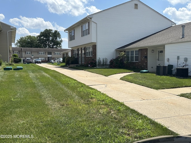 9 Maine Ct Unit 741, Matawan, NJ 07747 - view of front of property with brick siding and a front lawn