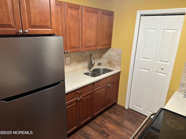9 Maine Ct Unit 741, Matawan, NJ 07747 - kitchen with freestanding refrigerator, light countertops, backsplash, dark wood-style flooring, and black / electric stove