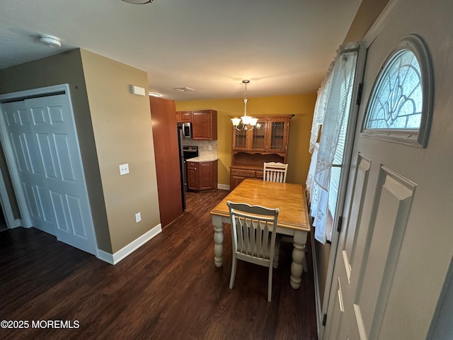 9 Maine Ct Unit 741, Matawan, NJ 07747 - dining room with dark wood finished floors and a chandelier
