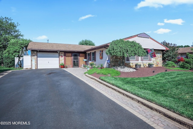 149 Idlewild Ln, Aberdeen, NJ 07747 - ranch-style house with an attached garage, asphalt driveway, and a front lawn