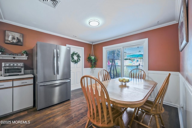 149 Idlewild Ln, Aberdeen, NJ 07747 - dining space with wainscoting, crown molding, dark wood-style floors, and a decorative wall