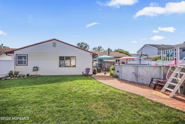 149 Idlewild Ln, Aberdeen, NJ 07747 - view of grassy yard featuring a patio and an outdoor pool