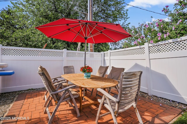 149 Idlewild Ln, Aberdeen, NJ 07747 - fenced backyard featuring a patio area and outdoor dining space