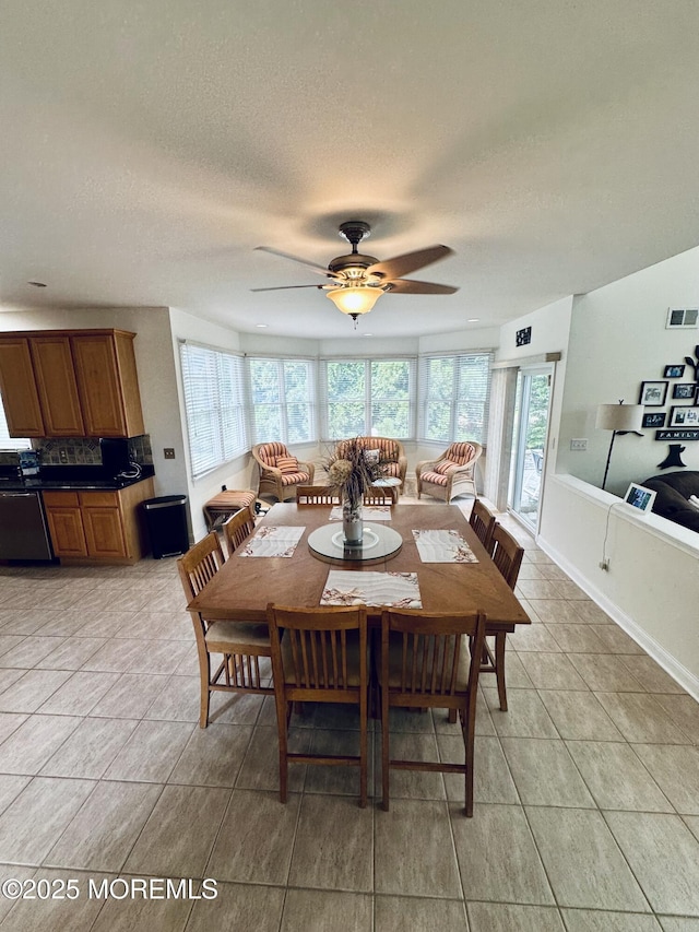 1642 Mink Ct, Toms River, NJ 08755 - dining space featuring healthy amount of natural light, ceiling fan, light tile patterned flooring, and a textured ceiling