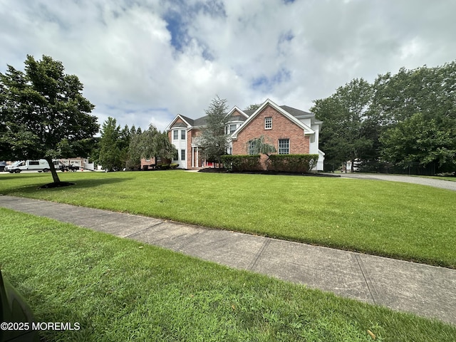 1642 Mink Ct, Toms River, NJ 08755 - view of front of home featuring brick siding and a front yard