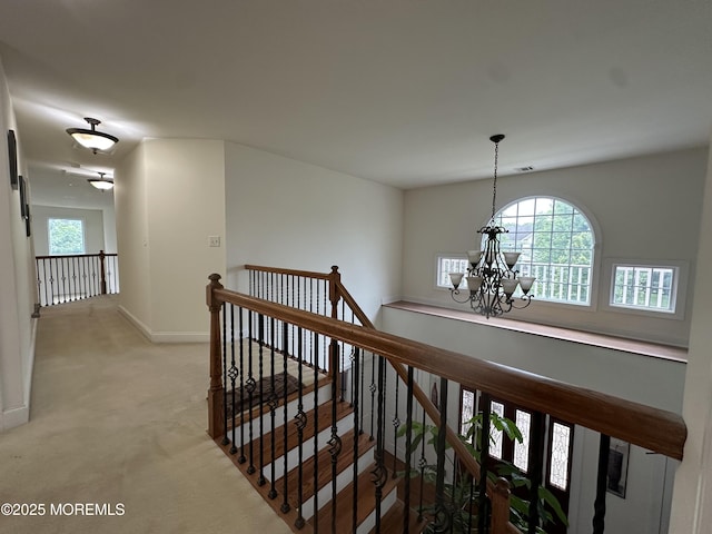 1642 Mink Ct, Toms River, NJ 08755 - hall with an upstairs landing, a chandelier, and light carpet
