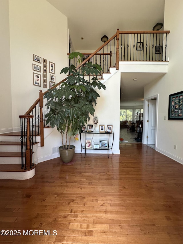1642 Mink Ct, Toms River, NJ 08755 - staircase with a high ceiling and wood finished floors