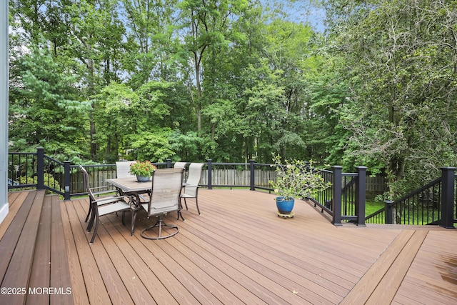 42 Nikki Ct, Morganville, NJ 07751 - wooden terrace with outdoor dining space and view of scattered trees
