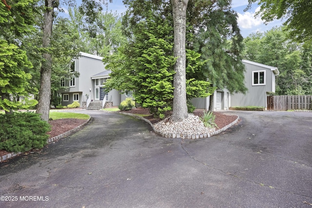 42 Nikki Ct, Morganville, NJ 07751 - view of front of house featuring driveway and a garage