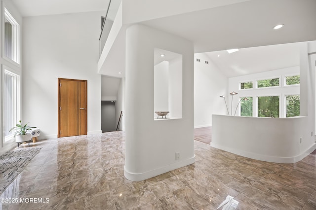 42 Nikki Ct, Morganville, NJ 07751 - hall with high vaulted ceiling, marble finish floors, and recessed lighting