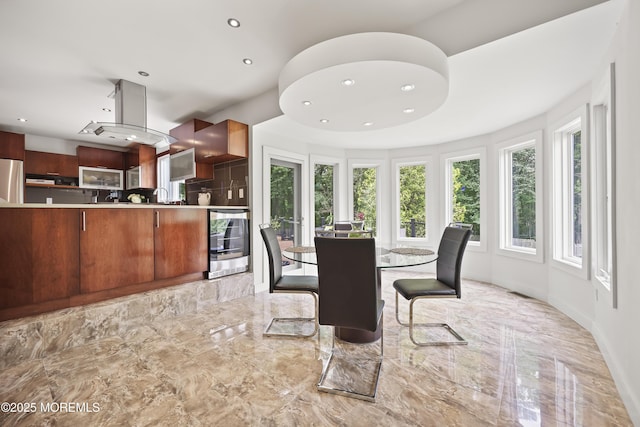 42 Nikki Ct, Morganville, NJ 07751 - dining room with wine cooler, recessed lighting, and light marble finish flooring