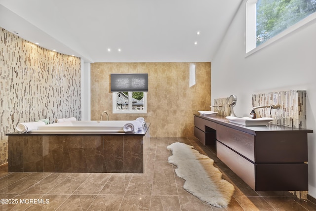 42 Nikki Ct, Morganville, NJ 07751 - full bath featuring a bath, plenty of natural light, double vanity, and vaulted ceiling