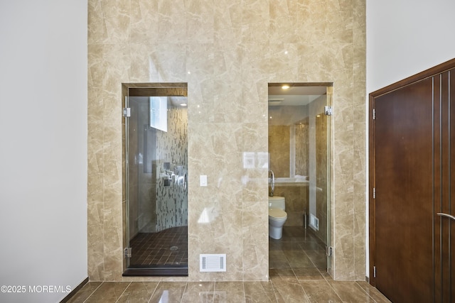 42 Nikki Ct, Morganville, NJ 07751 - bathroom featuring a stall shower and tile walls
