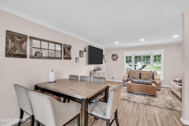 24 Willow Brook Rd, Freehold, NJ 07728 - dining room with light wood-type flooring, crown molding, and recessed lighting