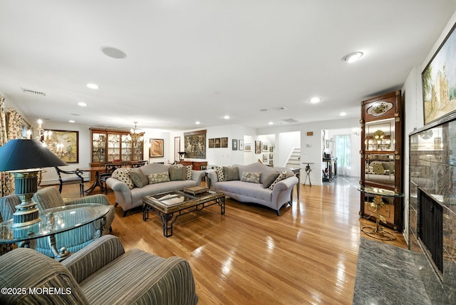 7 Stony Ridge Dr, Hillsdale, NJ 07642 - living room with stairway, light wood finished floors, recessed lighting, and a fireplace