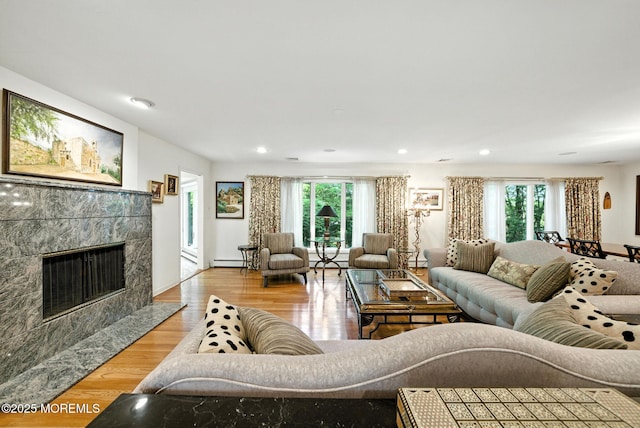 7 Stony Ridge Dr, Hillsdale, NJ 07642 - living room with a premium fireplace, light wood-type flooring, recessed lighting, and a baseboard radiator