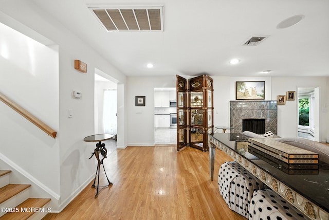 7 Stony Ridge Dr, Hillsdale, NJ 07642 - living room featuring light wood-style floors, a premium fireplace, stairs, and recessed lighting