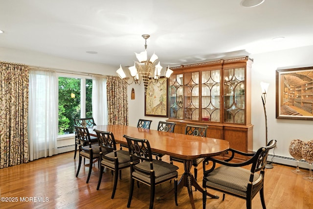 7 Stony Ridge Dr, Hillsdale, NJ 07642 - dining space with a chandelier, wood finished floors, and a baseboard radiator