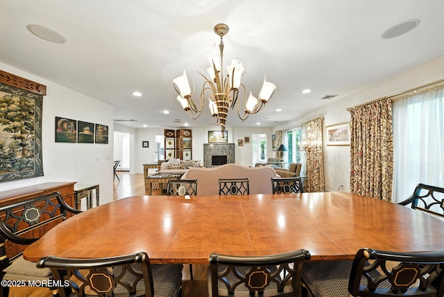 7 Stony Ridge Dr, Hillsdale, NJ 07642 - dining area featuring recessed lighting, a chandelier, and a fireplace
