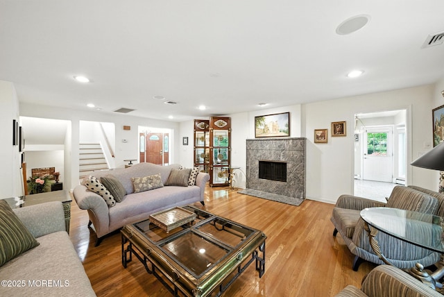 7 Stony Ridge Dr, Hillsdale, NJ 07642 - living area featuring recessed lighting, stairway, light wood-style floors, and a fireplace