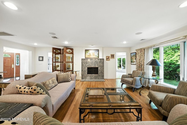 7 Stony Ridge Dr, Hillsdale, NJ 07642 - living area with wood finished floors, a tile fireplace, and recessed lighting
