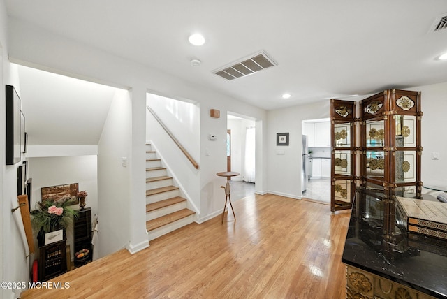 7 Stony Ridge Dr, Hillsdale, NJ 07642 - foyer entrance with stairs, light wood-style floors, and recessed lighting