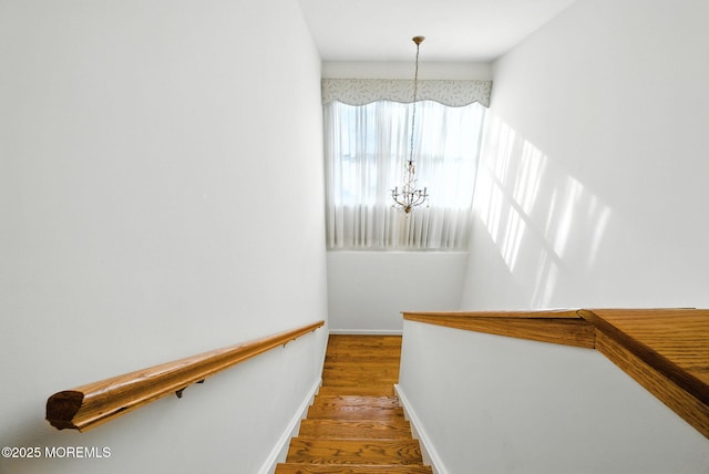 7 Stony Ridge Dr, Hillsdale, NJ 07642 - staircase featuring a chandelier and wood finished floors