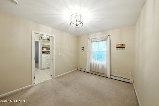 7 Stony Ridge Dr, Hillsdale, NJ 07642 - spare room featuring carpet flooring, a baseboard heating unit, and a chandelier