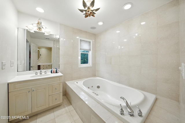 7 Stony Ridge Dr, Hillsdale, NJ 07642 - bathroom with a tub with jets, tile patterned floors, vanity, tile walls, and recessed lighting