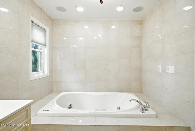 7 Stony Ridge Dr, Hillsdale, NJ 07642 - bathroom featuring a tub with jets, vanity, and tile walls