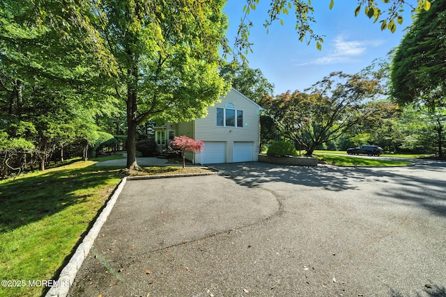 7 Stony Ridge Dr, Hillsdale, NJ 07642 - view of home's exterior featuring asphalt driveway, an attached garage, and a lawn