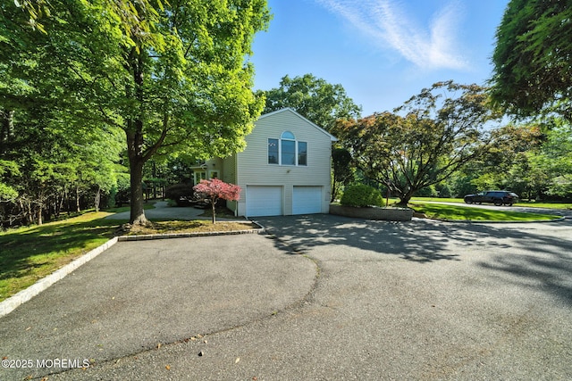 7 Stony Ridge Dr, Hillsdale, NJ 07642 - view of property exterior with an attached garage, driveway, and view of wooded area