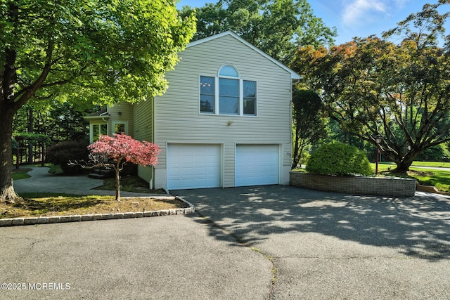 7 Stony Ridge Dr, Hillsdale, NJ 07642 - view of side of home with driveway and an attached garage