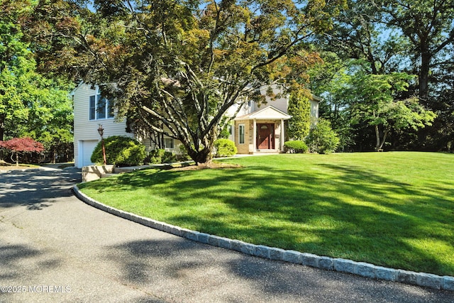 7 Stony Ridge Dr, Hillsdale, NJ 07642 - view of front facade with a garage, driveway, and a front lawn