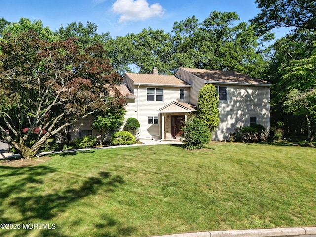 7 Stony Ridge Dr, Hillsdale, NJ 07642 - traditional-style house with a chimney and a front lawn