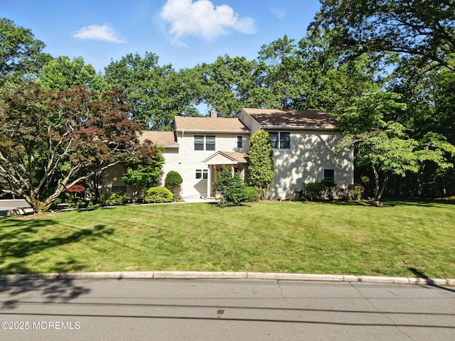 7 Stony Ridge Dr, Hillsdale, NJ 07642 - view of front of property with a front lawn and a chimney
