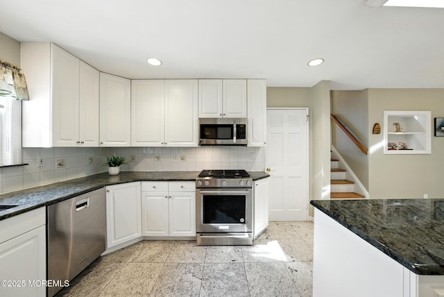 7 Stony Ridge Dr, Hillsdale, NJ 07642 - kitchen with stainless steel appliances, white cabinetry, decorative backsplash, recessed lighting, and dark stone counters