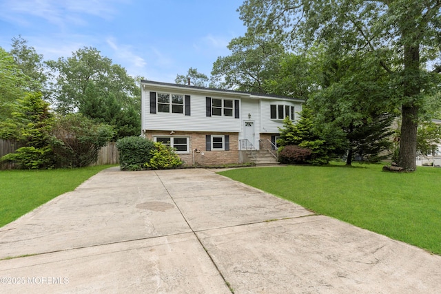 424 River Ter, Toms River, NJ 08755 - split foyer home featuring concrete driveway and brick siding