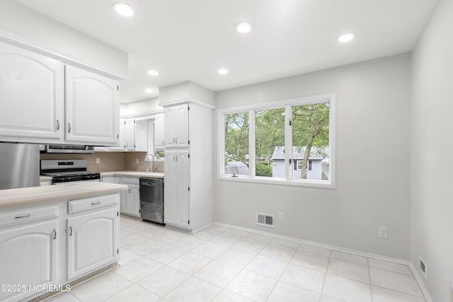 424 River Ter, Toms River, NJ 08755 - kitchen with dishwasher, stove, light countertops, white cabinetry, and recessed lighting
