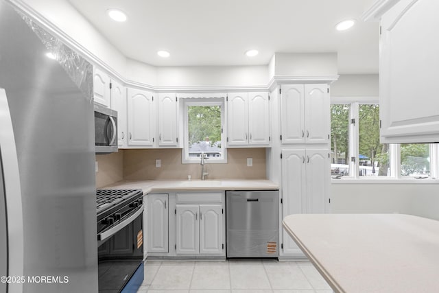 424 River Ter, Toms River, NJ 08755 - kitchen with appliances with stainless steel finishes, healthy amount of natural light, light countertops, white cabinets, and recessed lighting