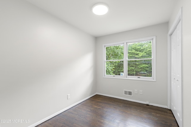 424 River Ter, Toms River, NJ 08755 - unfurnished bedroom featuring dark wood-style flooring and a closet