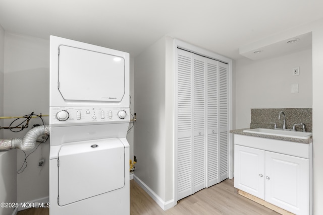 424 River Ter, Toms River, NJ 08755 - laundry area featuring stacked washing machine and dryer and light wood finished floors