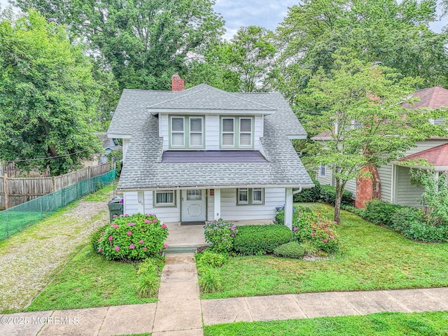 1416 Garven Ave, Ocean Twp, NJ 07712 - bungalow featuring covered porch, roof with shingles, and a chimney