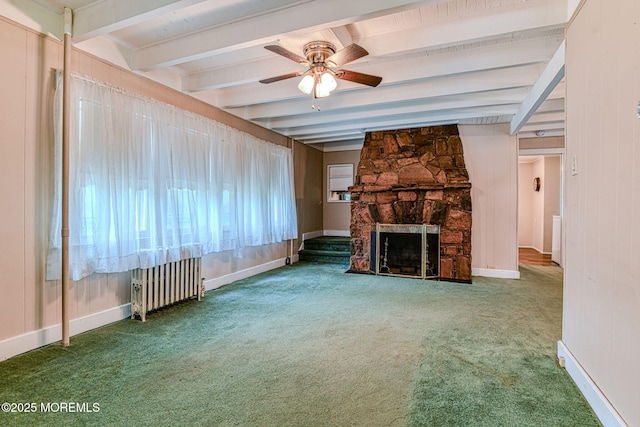 1416 Garven Ave, Ocean Twp, NJ 07712 - unfurnished living room featuring radiator heating unit, a ceiling fan, carpet flooring, beamed ceiling, and a fireplace