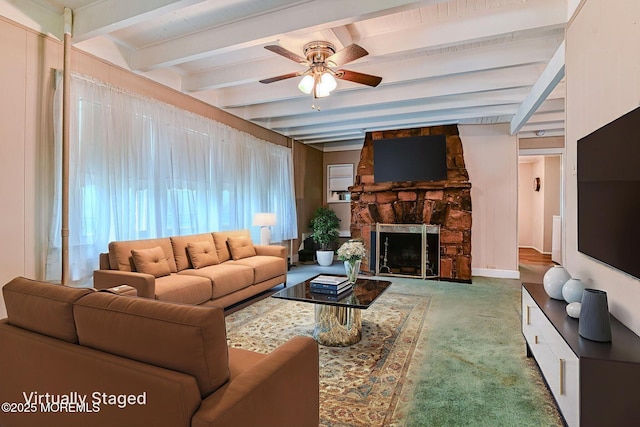 1416 Garven Ave, Ocean Twp, NJ 07712 - living room with a ceiling fan, beam ceiling, a stone fireplace, and carpet floors